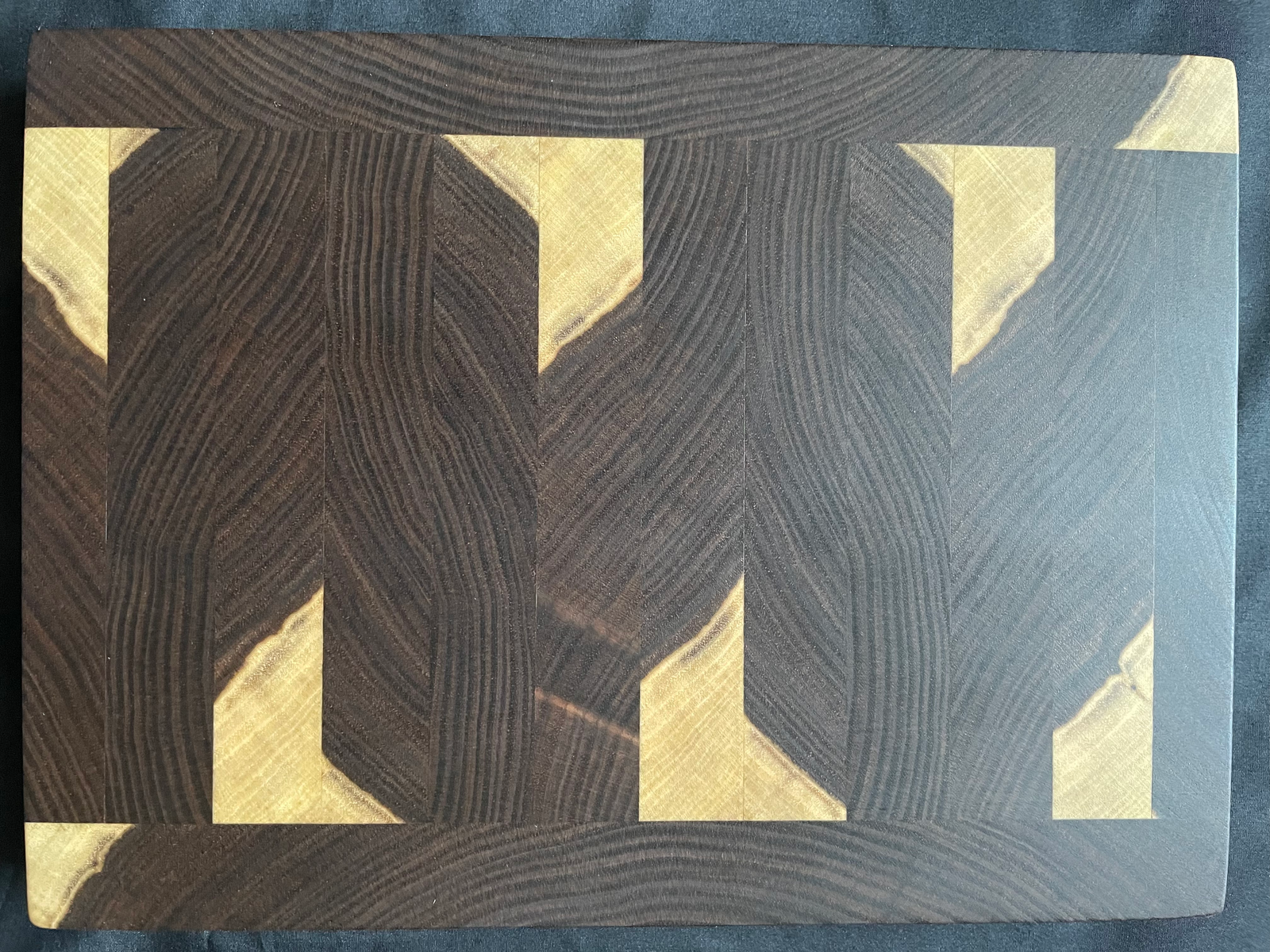 walnut end-grain handmade cutting boards w/ a sapwood pattern.